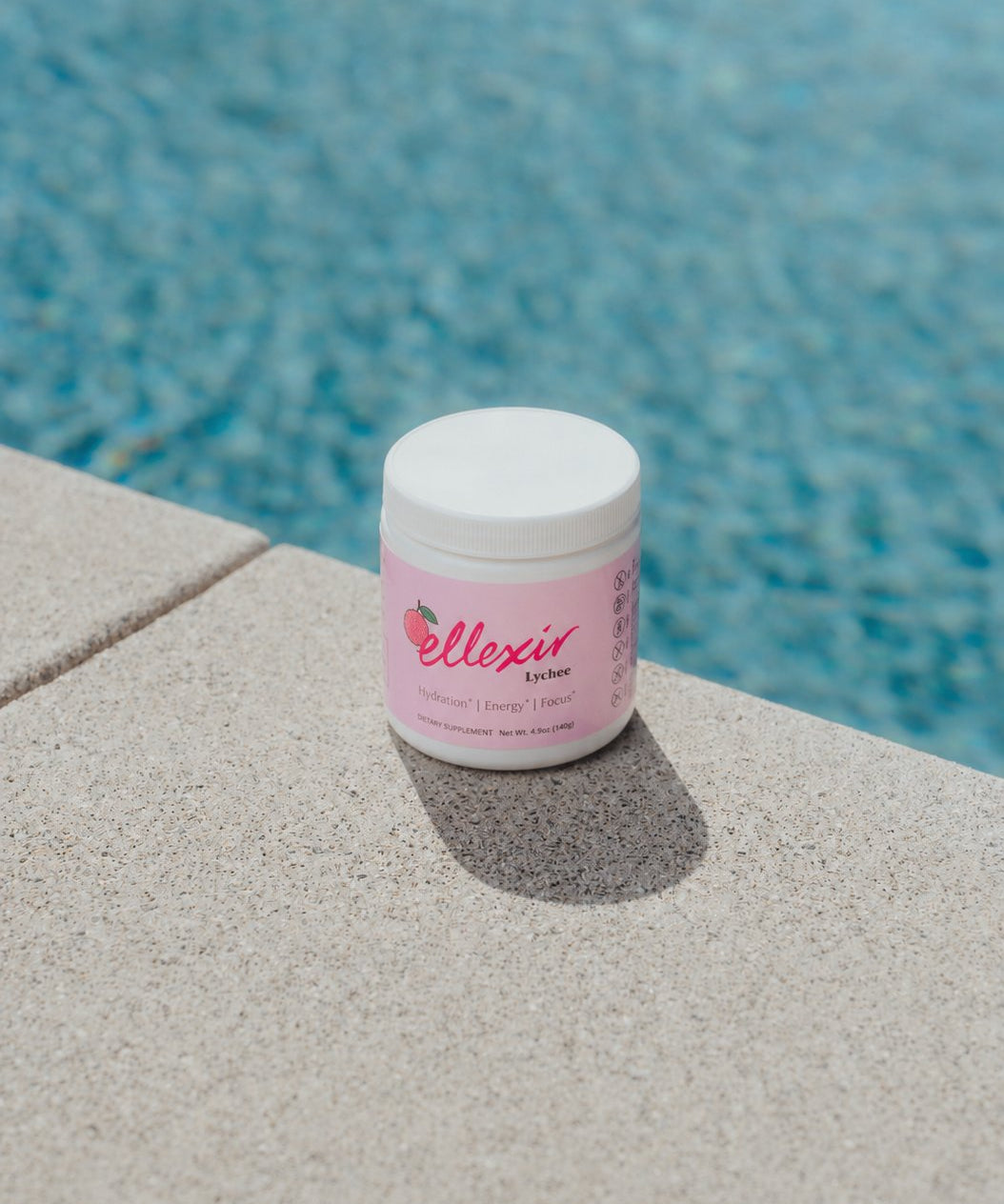 Ellexir Lychee Energy jar poolside